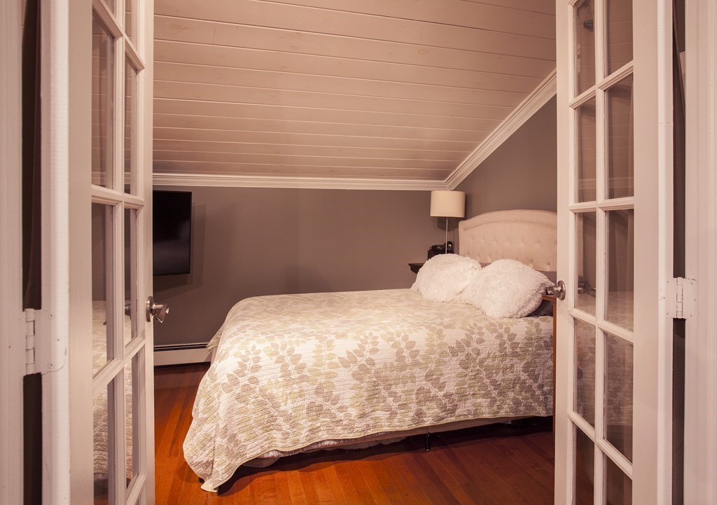 295 Stumpfield Road Hopkinton, NH 03229 - Photo 24 of 36 a bed sitting in a bedroom next to a window