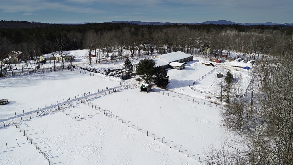 295 Stumpfield Road Hopkinton, NH 03229 - Photo 31 of 36 a view of a lake with a mountain