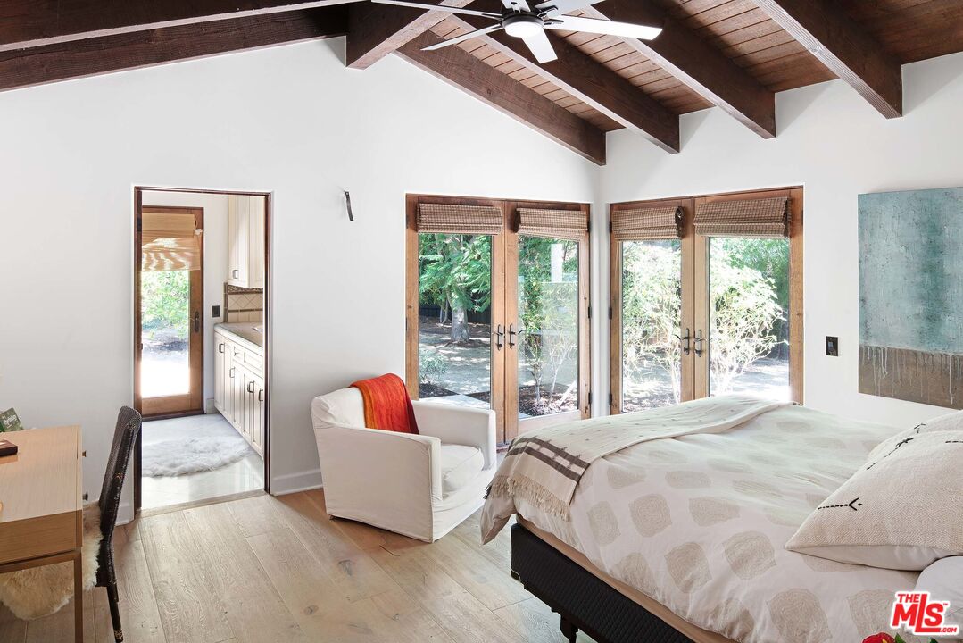 2251 Cold Canyon Road Calabasas, CA 91302 - Photo 20 of 47 a bedroom with a bed and a large window