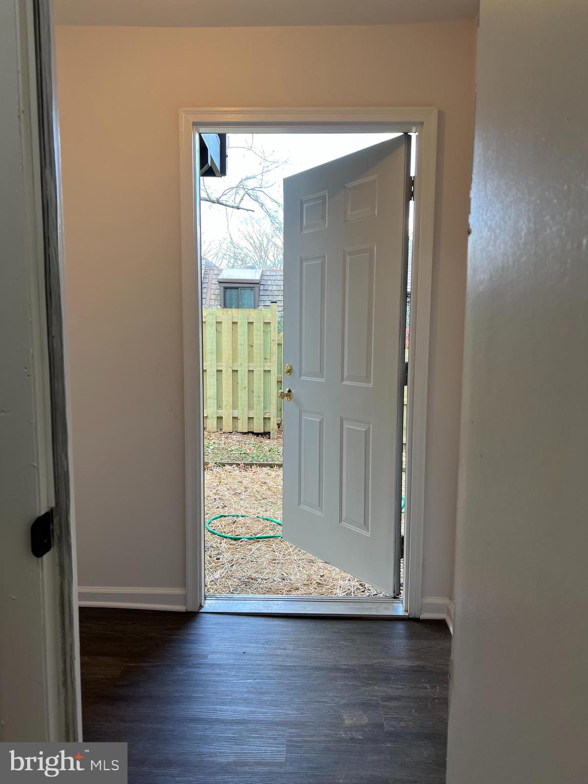 1546 Scandia Circle Reston, VA 20190 - Photo 15 of 24 a view of an empty room with wooden floor and a window