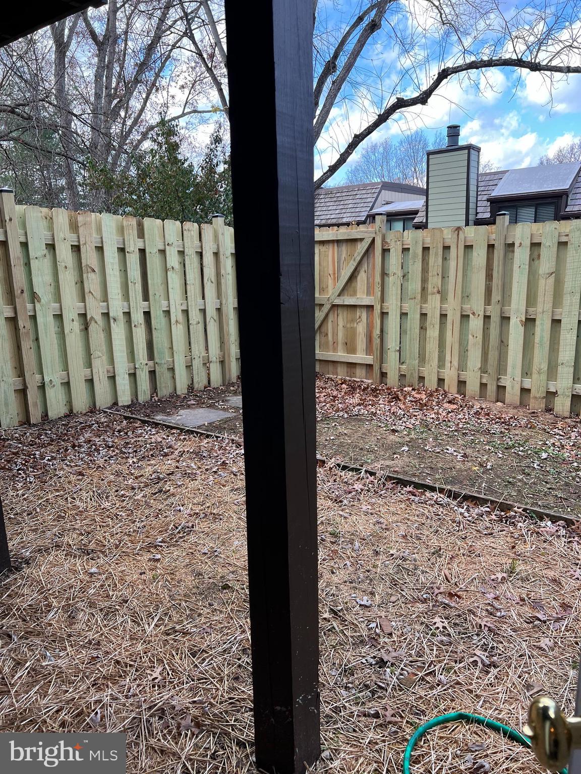 1546 Scandia Circle Reston, VA 20190 - Photo 17 of 24 a view of a backyard with wooden fence
