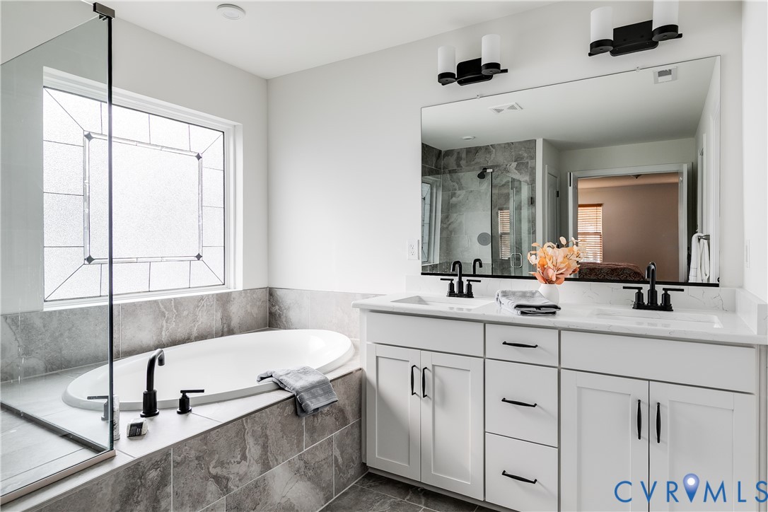 10123 Peach Blossom Road Mechanicsville, VA 23116 - Photo 33 of 49 a bathroom with a sink and a mirror