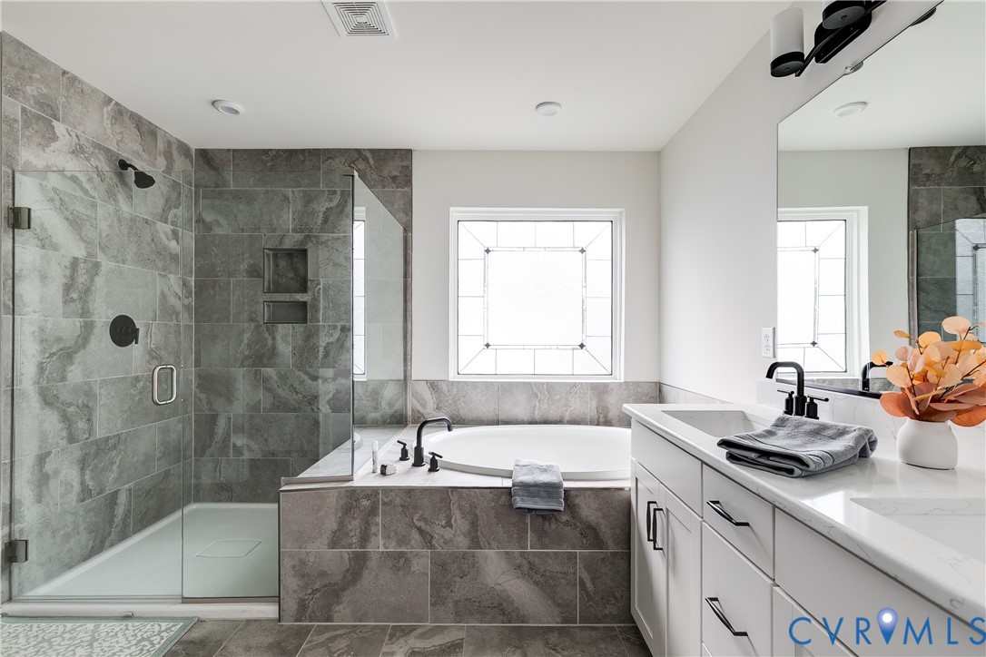 10123 Peach Blossom Road Mechanicsville, VA 23116 - Photo 35 of 49 a bathroom with a tub sink and mirror