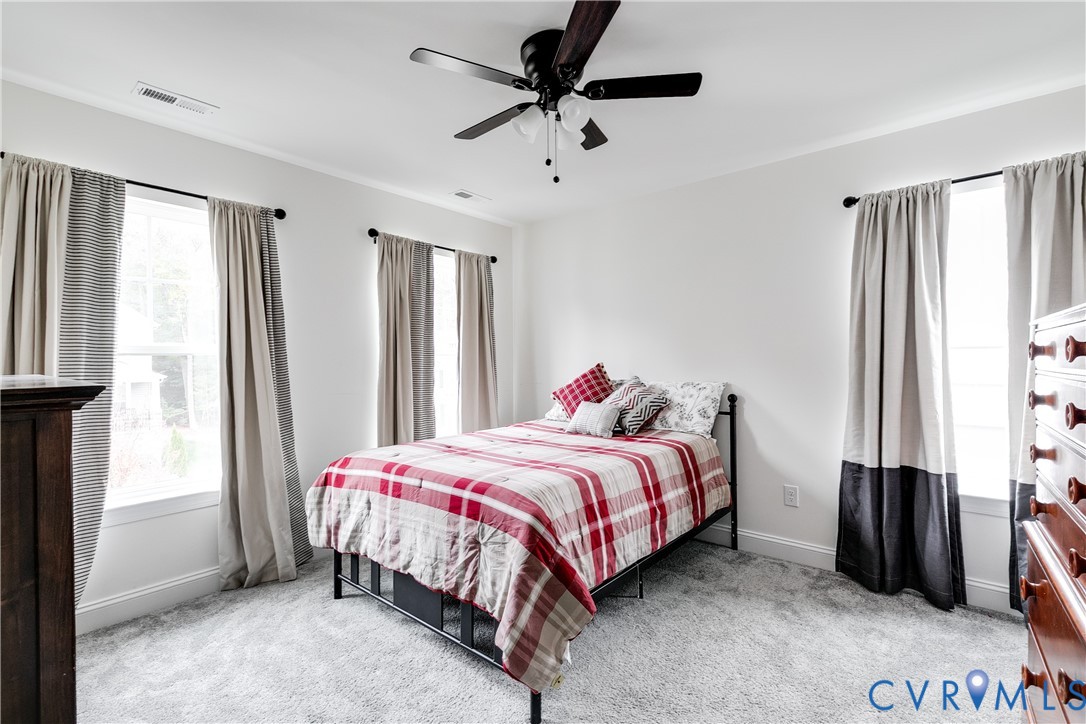10123 Peach Blossom Road Mechanicsville, VA 23116 - Photo 39 of 49 a bedroom with a bed and a window