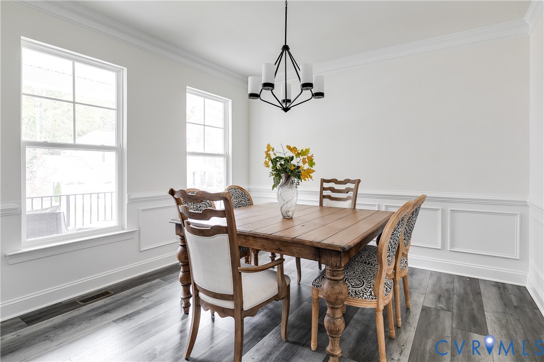10123 Peach Blossom Road Mechanicsville, VA 23116 - Photo 6 of 49 a view of a dining room with furniture window and wooden floor