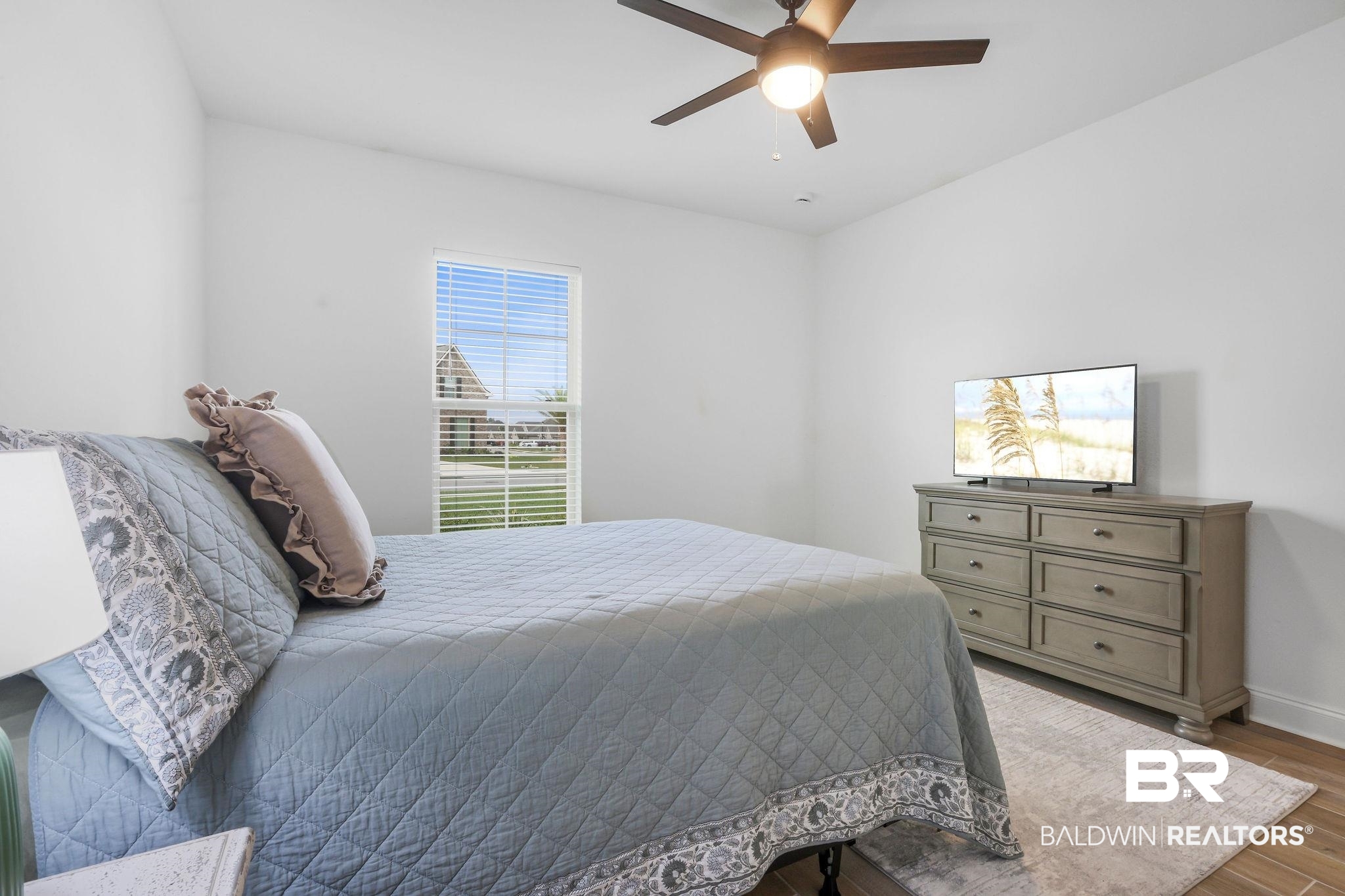 9855 Chipper Lane Foley, AL 36535 - Photo 41 of 48 Bedroom featuring hardwood / wood-style flooring and ceiling fan