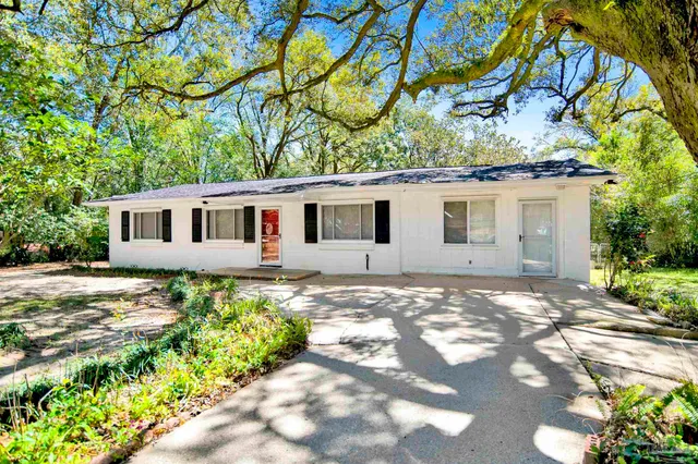 a view of a backyard of the house