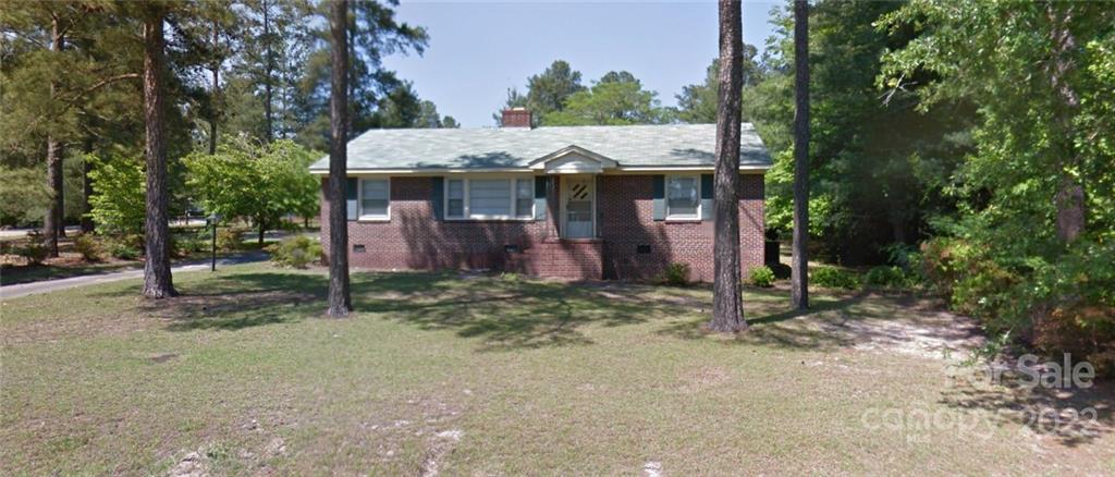 203 Woodland Road Rockingham, NC 28379 - Photo 1 of 1 a view of a house with a yard