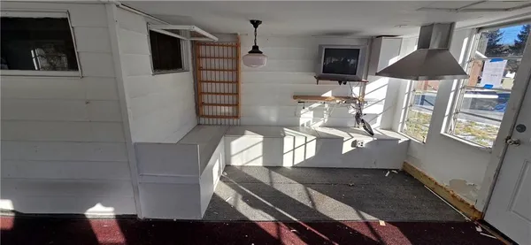 a view of empty room with windows