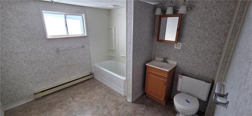 201 Adele Street Lilly, PA 15938 - Photo 17 of 25 a bathroom with a toilet and a bathtub