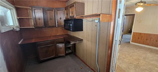 a kitchen with stainless steel appliances granite countertop a refrigerator and a stove