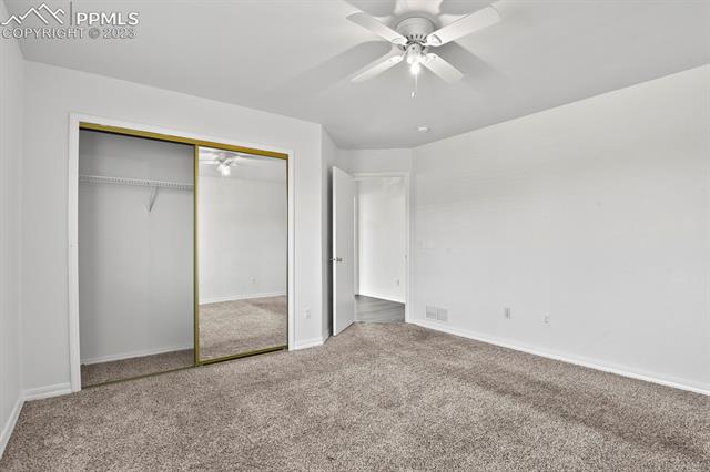 8161 Ferguson Road Peyton, CO 80831 - Photo 13 of 29 Mirrored Closet Door and Ceiling Fan