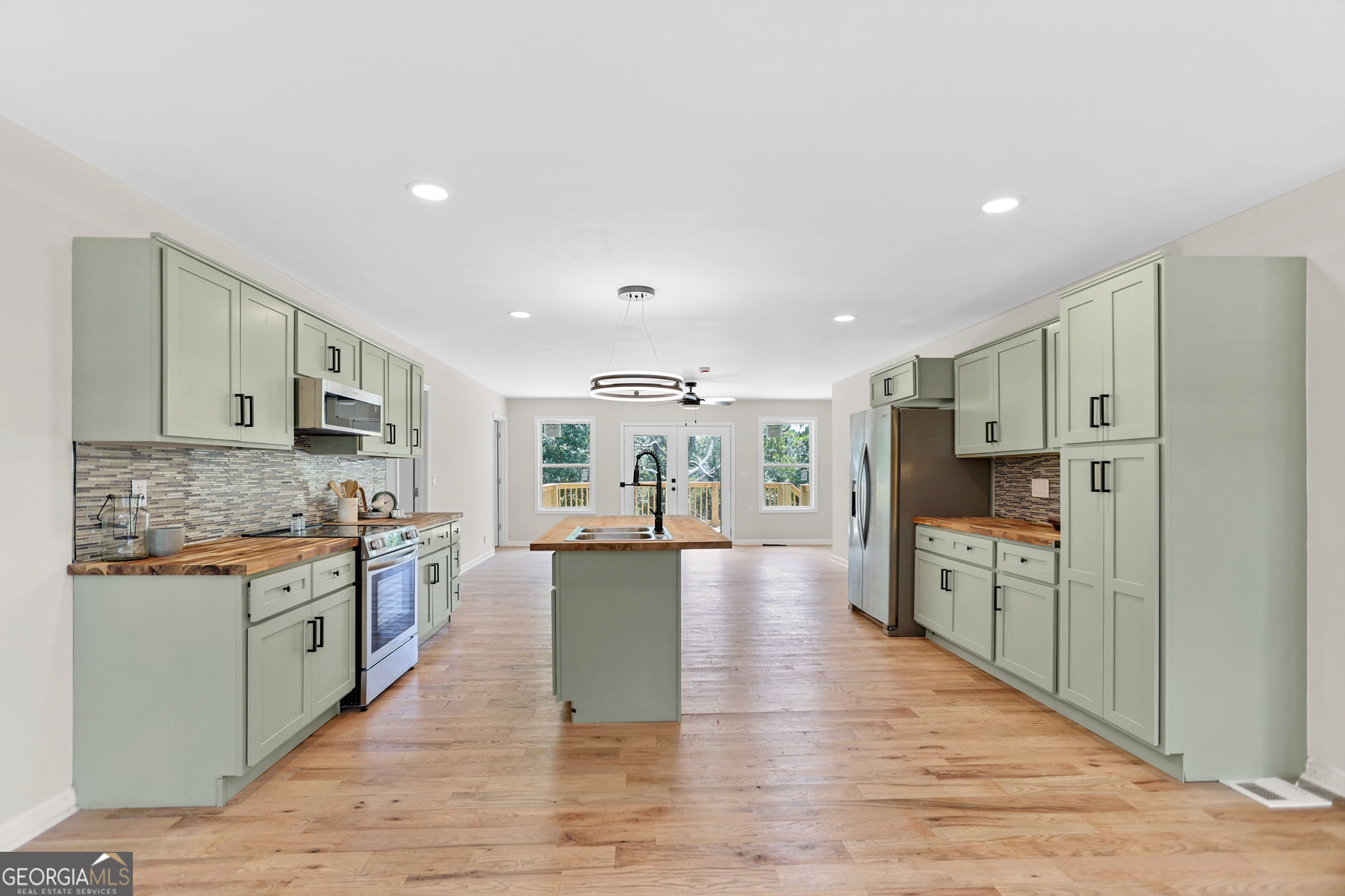 7060 Scenic Heights Road Manchester, GA 31816 - Photo 14 of 52 a large kitchen with cabinets and stainless steel appliances