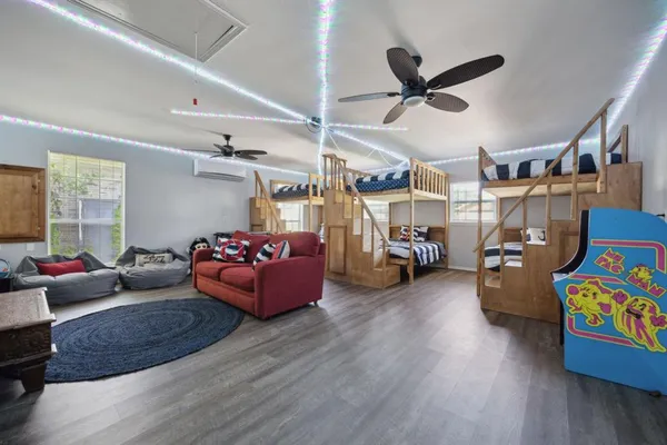 a living room with lots of furniture and a chandelier