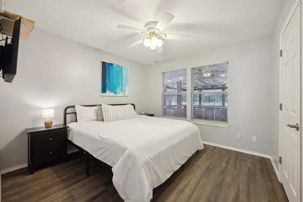 a bedroom with bed and window