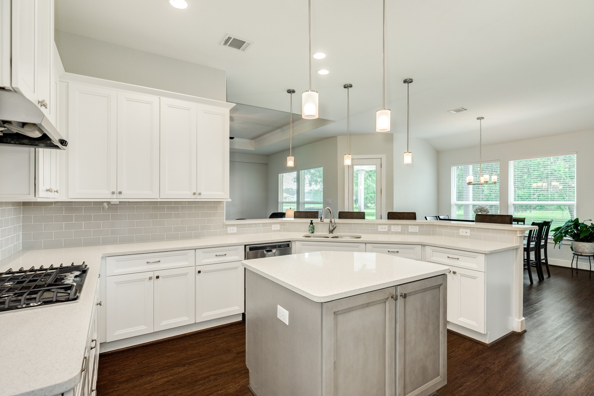527 Lakeland Circle Rosharon, TX 77583 - Photo 23 of 42 a kitchen with a sink a stove a refrigerator and white cabinets
