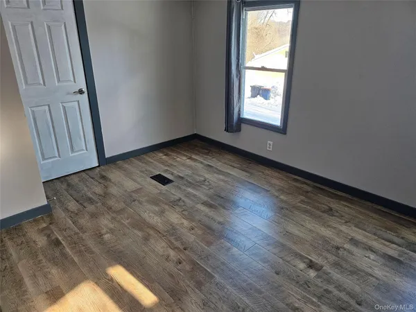 a view of an empty room and window