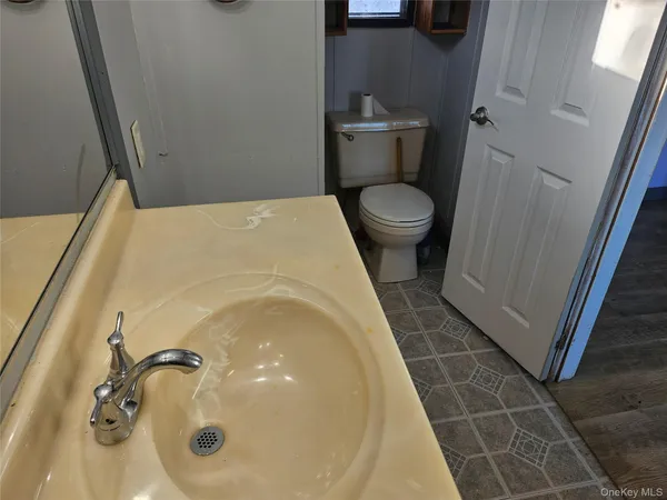 a bathroom with a toilet and a tub