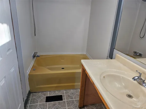 a bathroom with a sink and washing machine