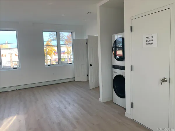 a view of an entryway with wooden floor