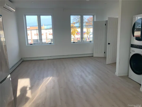 a view of livingroom with hardwood floor and window