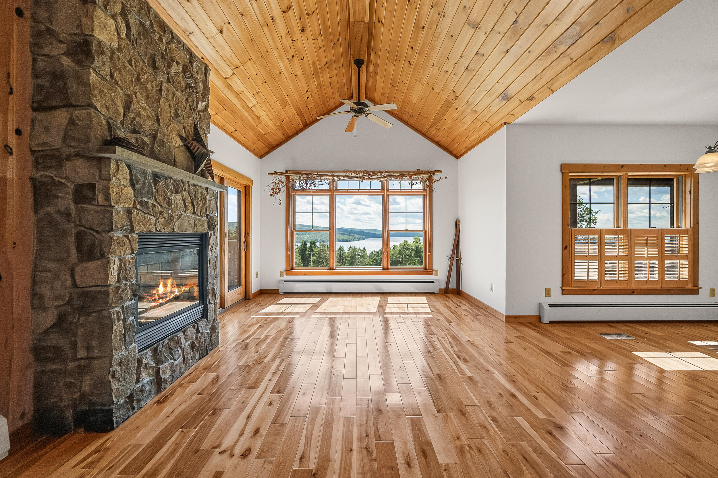 11 Whip Willow Farm Road, Unit 4 Rangeley, ME 04970 - Photo 6 of 35 Living and Fireplace