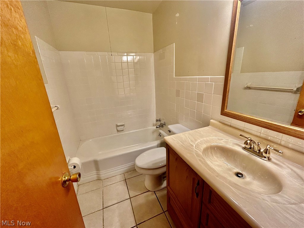 501 Edison Street Struthers, OH 44471 - Photo 12 of 23 ceramic flooring and newer vannity top and hardware