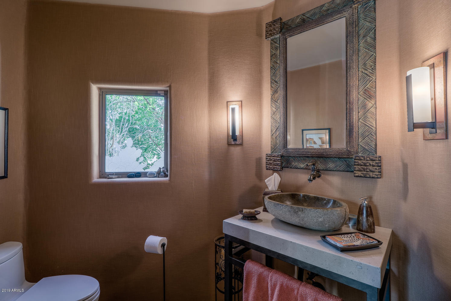 10040 East Happy Valley Road, Unit 442 Scottsdale, AZ 85255 - Photo 26 of 78 a bathroom with a sink toilet and mirror