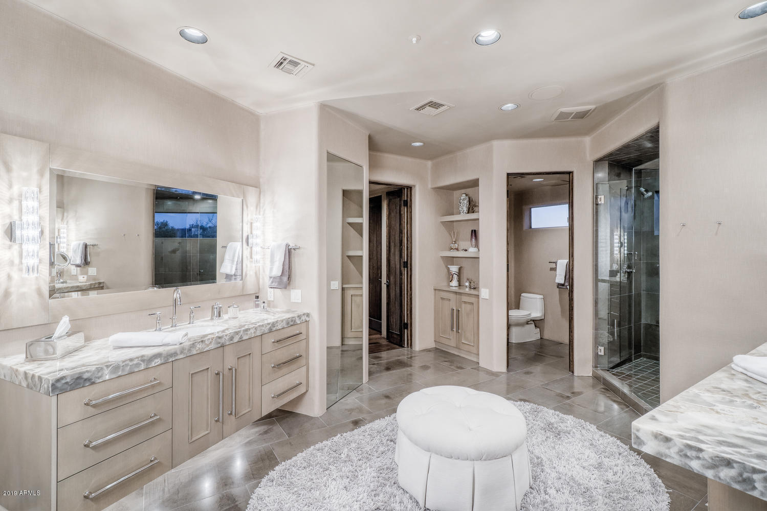10040 East Happy Valley Road, Unit 442 Scottsdale, AZ 85255 - Photo 33 of 78 a spacious bathroom with a granite countertop sink and a mirror