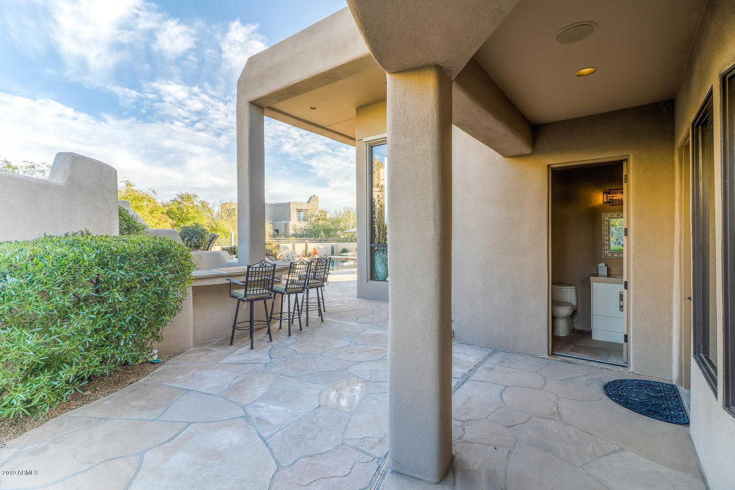 10040 East Happy Valley Road, Unit 442 Scottsdale, AZ 85255 - Photo 49 of 78 a view of a porch with chairs and backyard