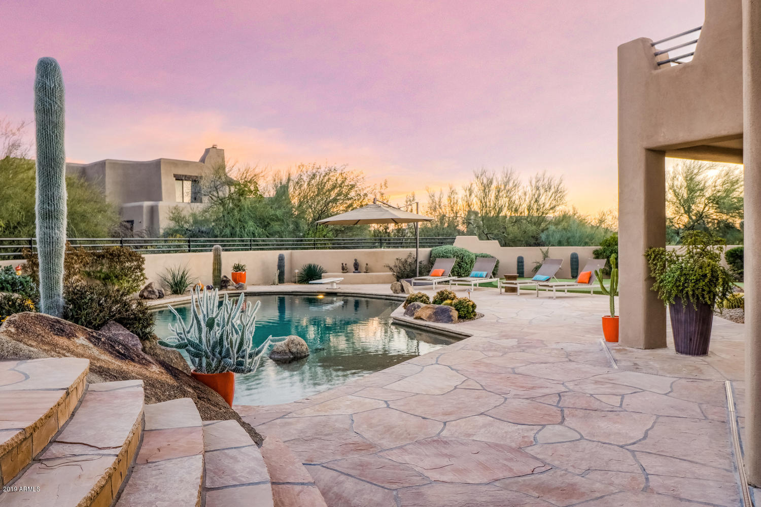 10040 East Happy Valley Road, Unit 442 Scottsdale, AZ 85255 - Photo 62 of 78 a view of roof deck with table and chairs couches with wooden fence