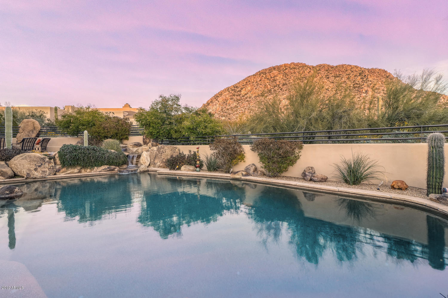 10040 East Happy Valley Road, Unit 442 Scottsdale, AZ 85255 - Photo 63 of 78 a view of a lake with a mountain in the background