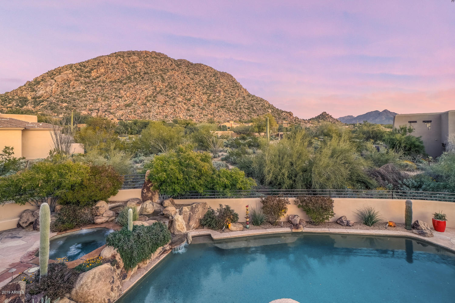 10040 East Happy Valley Road, Unit 442 Scottsdale, AZ 85255 - Photo 64 of 78 a view of a lake with a mountain in the background