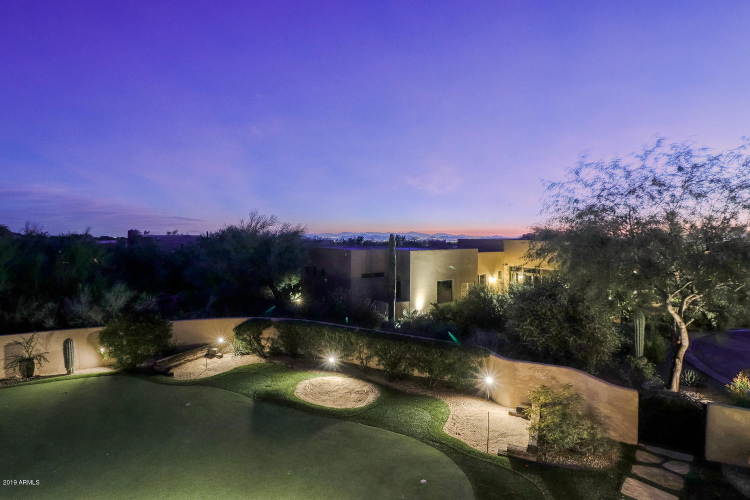 10040 East Happy Valley Road, Unit 442 Scottsdale, AZ 85255 - Photo 66 of 78 a view of a lake with a house in the background