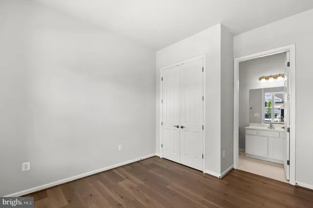 a bathroom with a double vanity sink and mirror