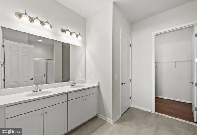 a bathroom with a glass shower door