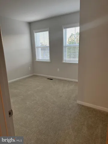 a bathroom with a double vanity sink and mirror