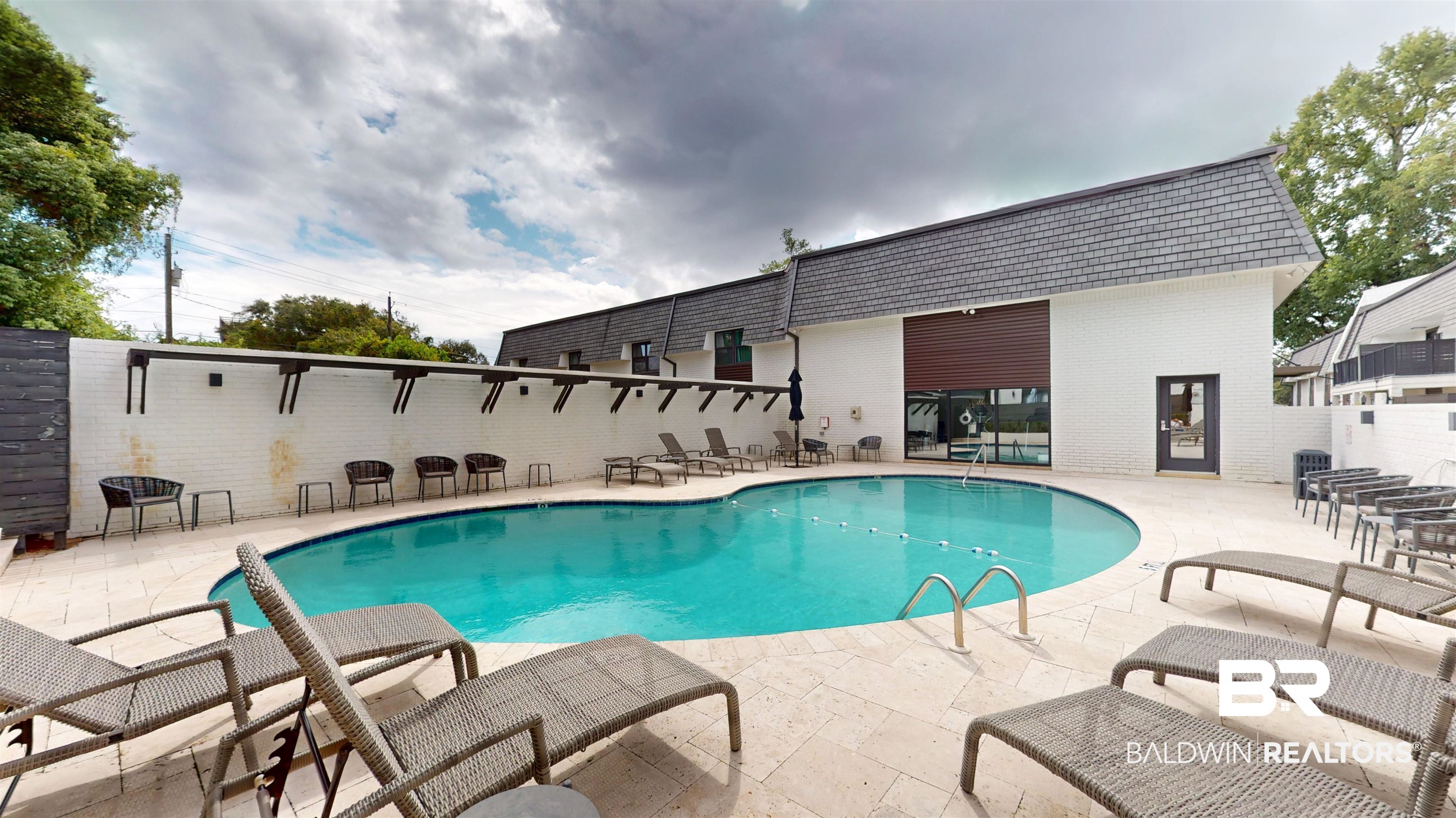 3655 Old Shell Road, Unit 219 Mobile, AL 36608 - Photo 17 of 25 Community pool featuring a patio
