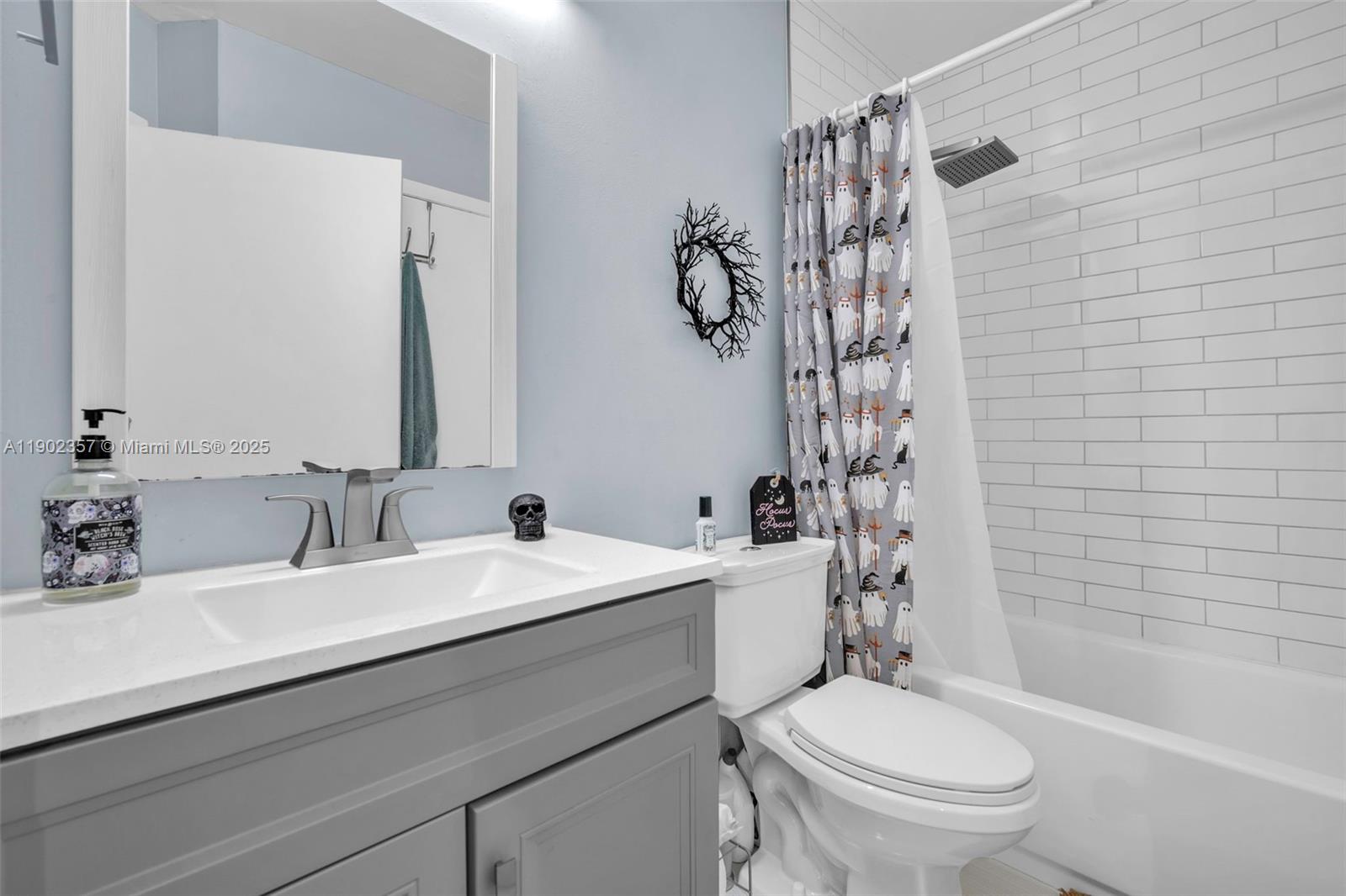 9507 Southwest 140th Court, Unit 9507 Miami, FL 33186 - Photo 12 of 19 a bathroom with a sink a toilet and shower