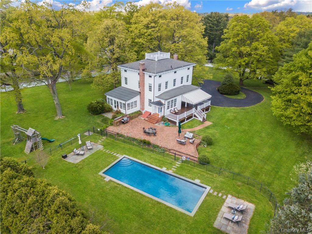 77 Pleasant Ridge Road Harrison, NY 10528 - Photo 1 of 35 an aerial view of a house with a garden