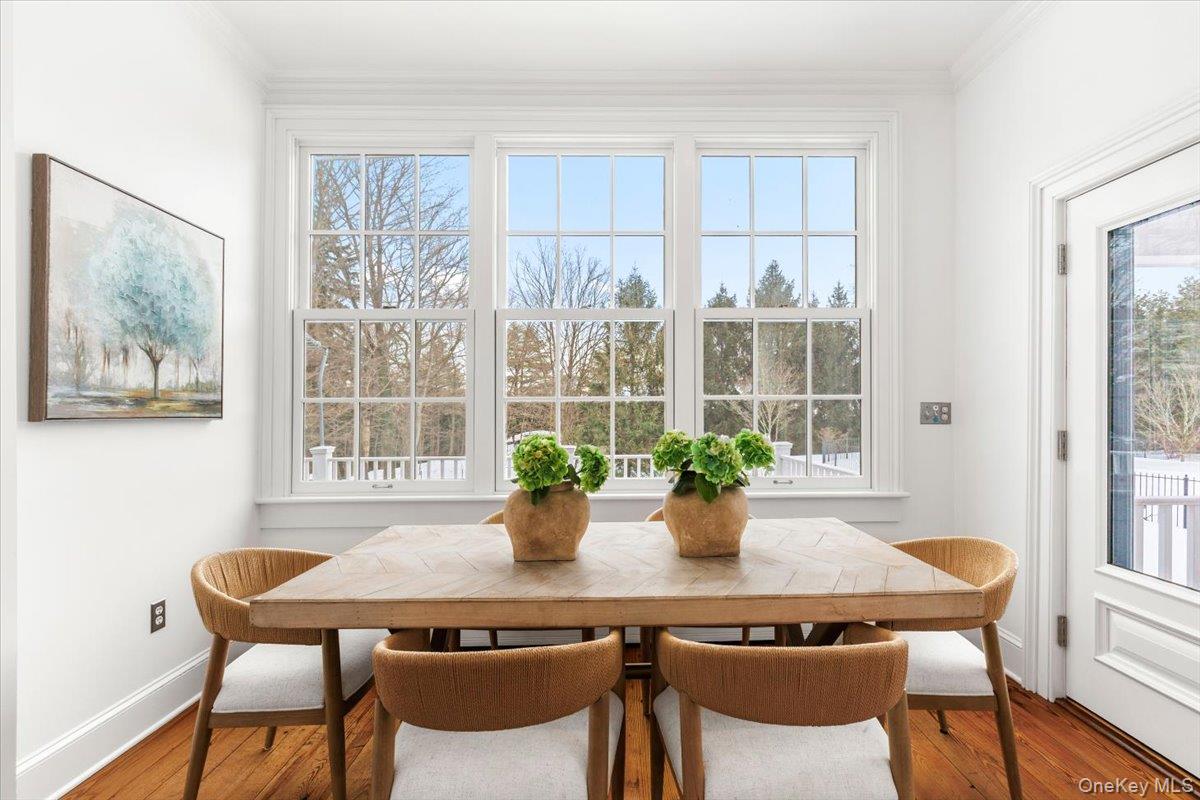 77 Pleasant Ridge Road Harrison, NY 10528 - Photo 14 of 35 a view of a dining room with furniture window and wooden floor