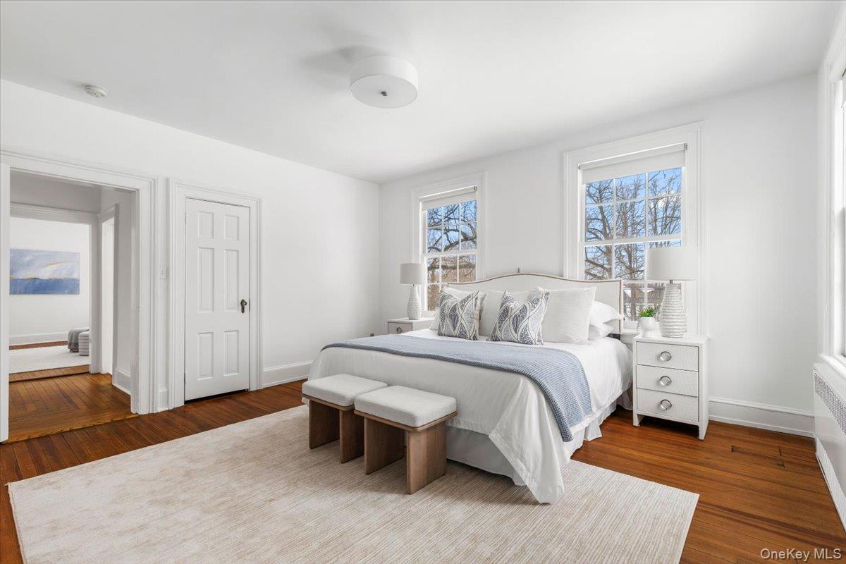 77 Pleasant Ridge Road Harrison, NY 10528 - Photo 16 of 35 a spacious bedroom with a bed and a table