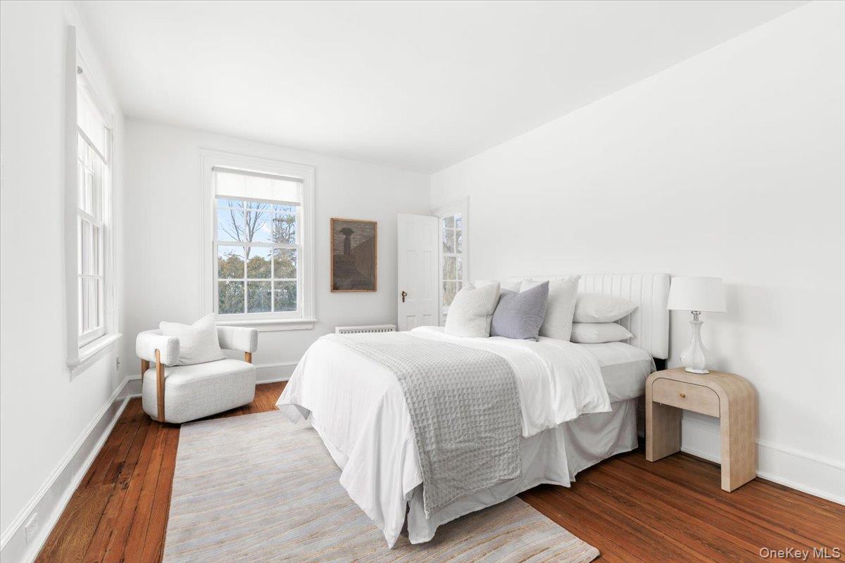 77 Pleasant Ridge Road Harrison, NY 10528 - Photo 20 of 35 a bedroom with a bed and a couch
