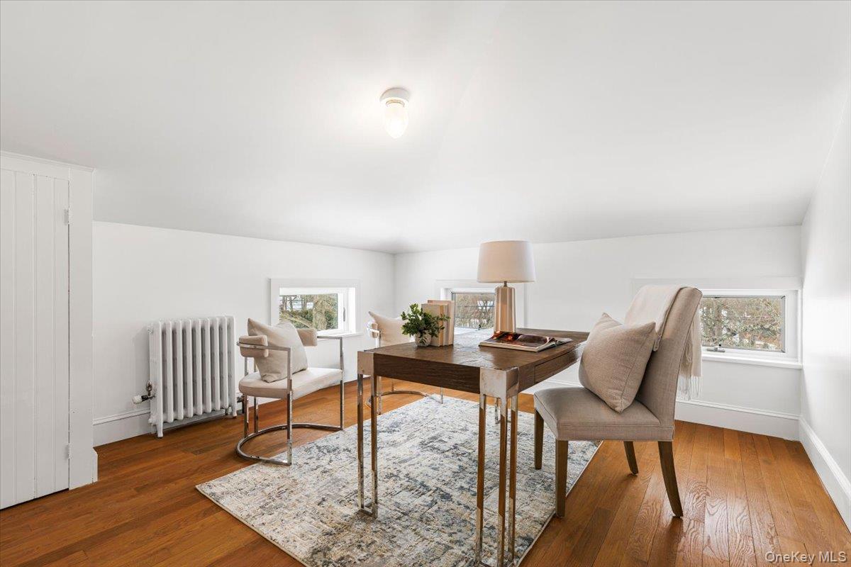 77 Pleasant Ridge Road Harrison, NY 10528 - Photo 24 of 35 a view of a workspace with furniture and wooden floor