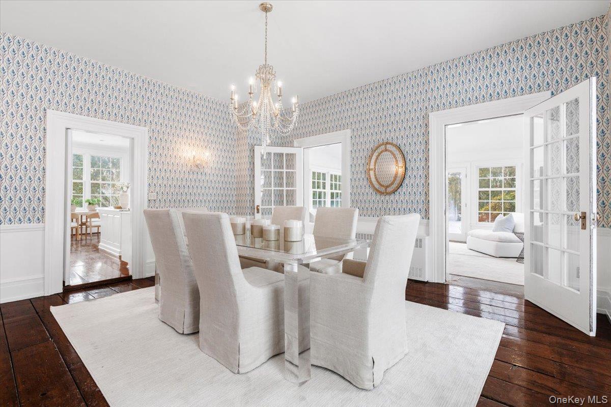 77 Pleasant Ridge Road Harrison, NY 10528 - Photo 10 of 35 a view of a dining room with furniture wooden floor and chandelier