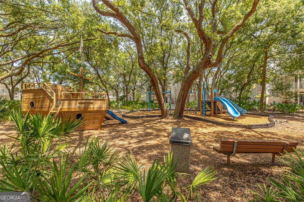 1175 North Beachview Drive, Unit 234 Jekyll Island, GA 31527 - Photo 12 of 17 a view of outdoor space with garden