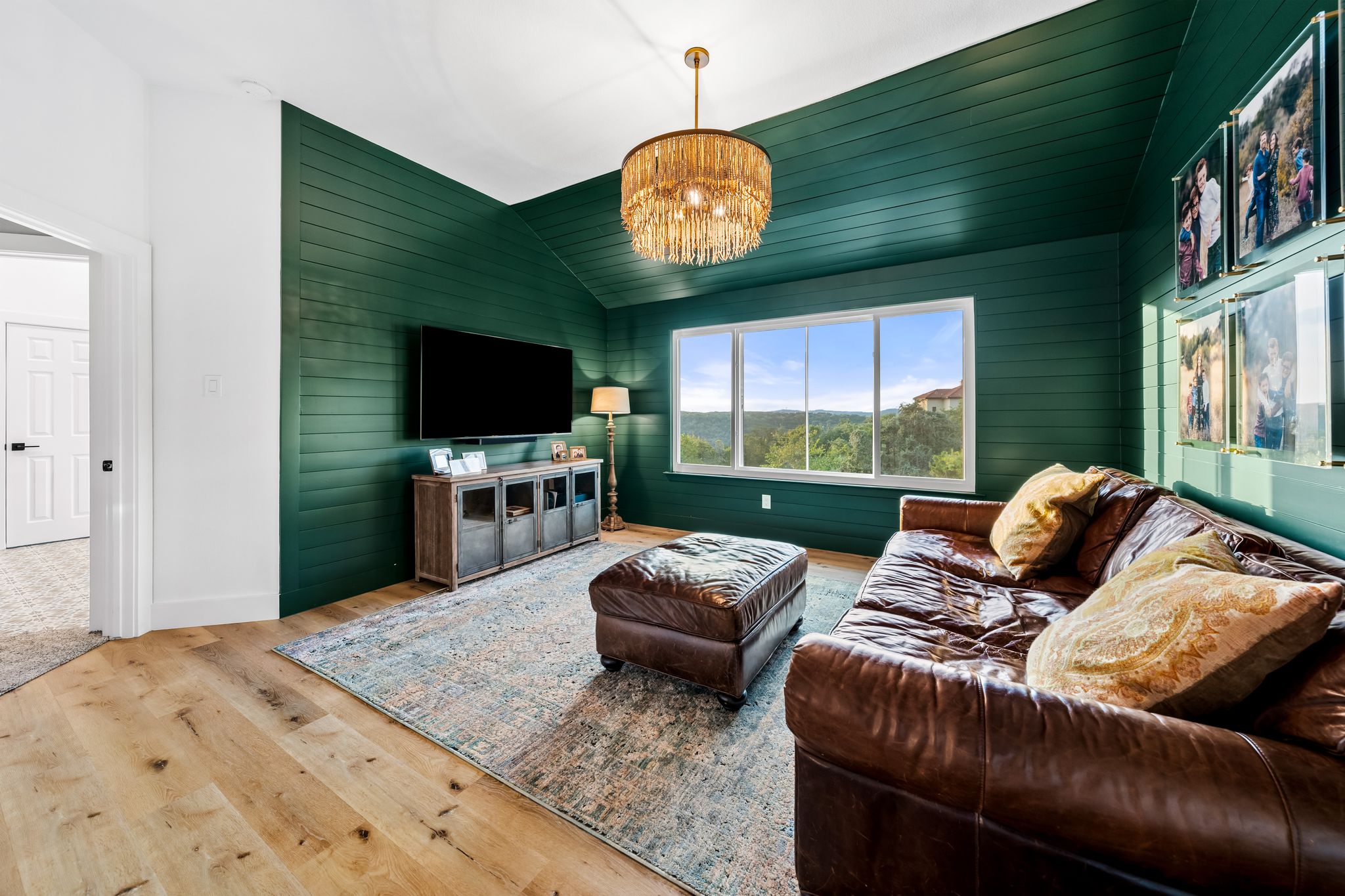 2204 Rimrock Drive Austin, TX 78738 - Photo 14 of 39 Rich wood planking on the walls and vaulted ceiling frames sweeping hills views.