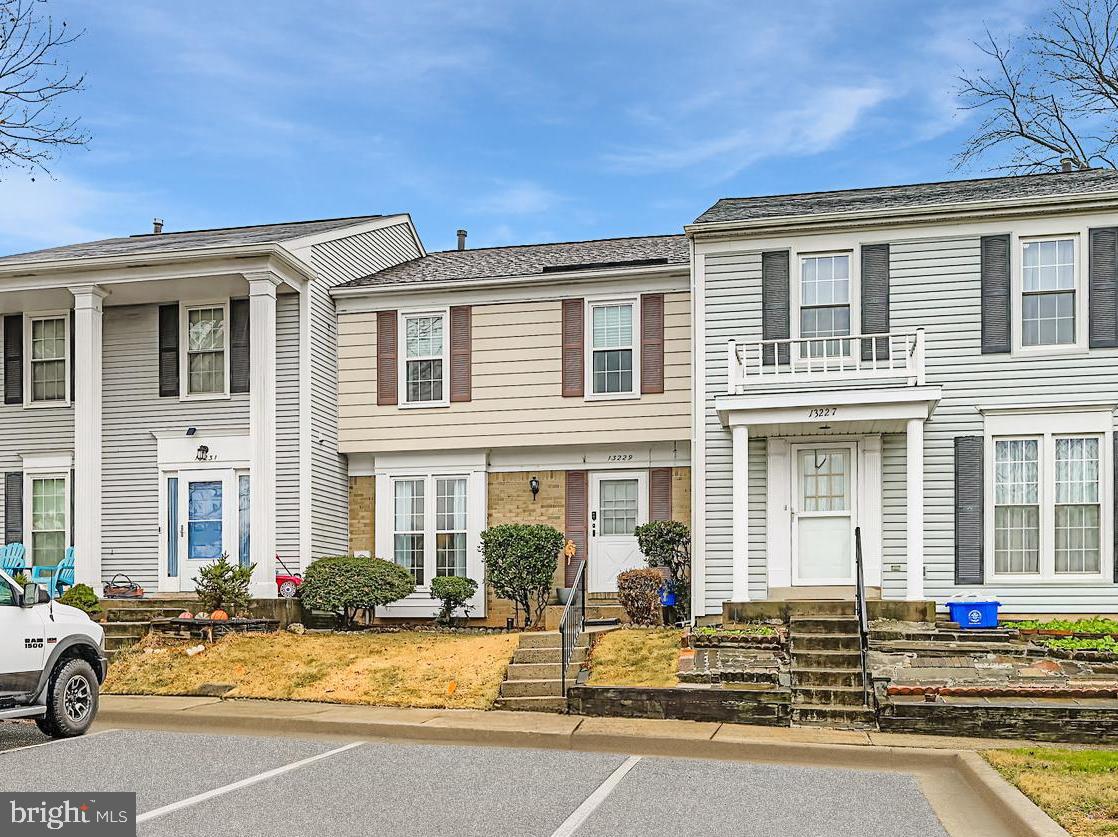 13229 Country Ridge Drive Germantown, MD 20874 - Photo 1 of 24 a front view of a house with a yard