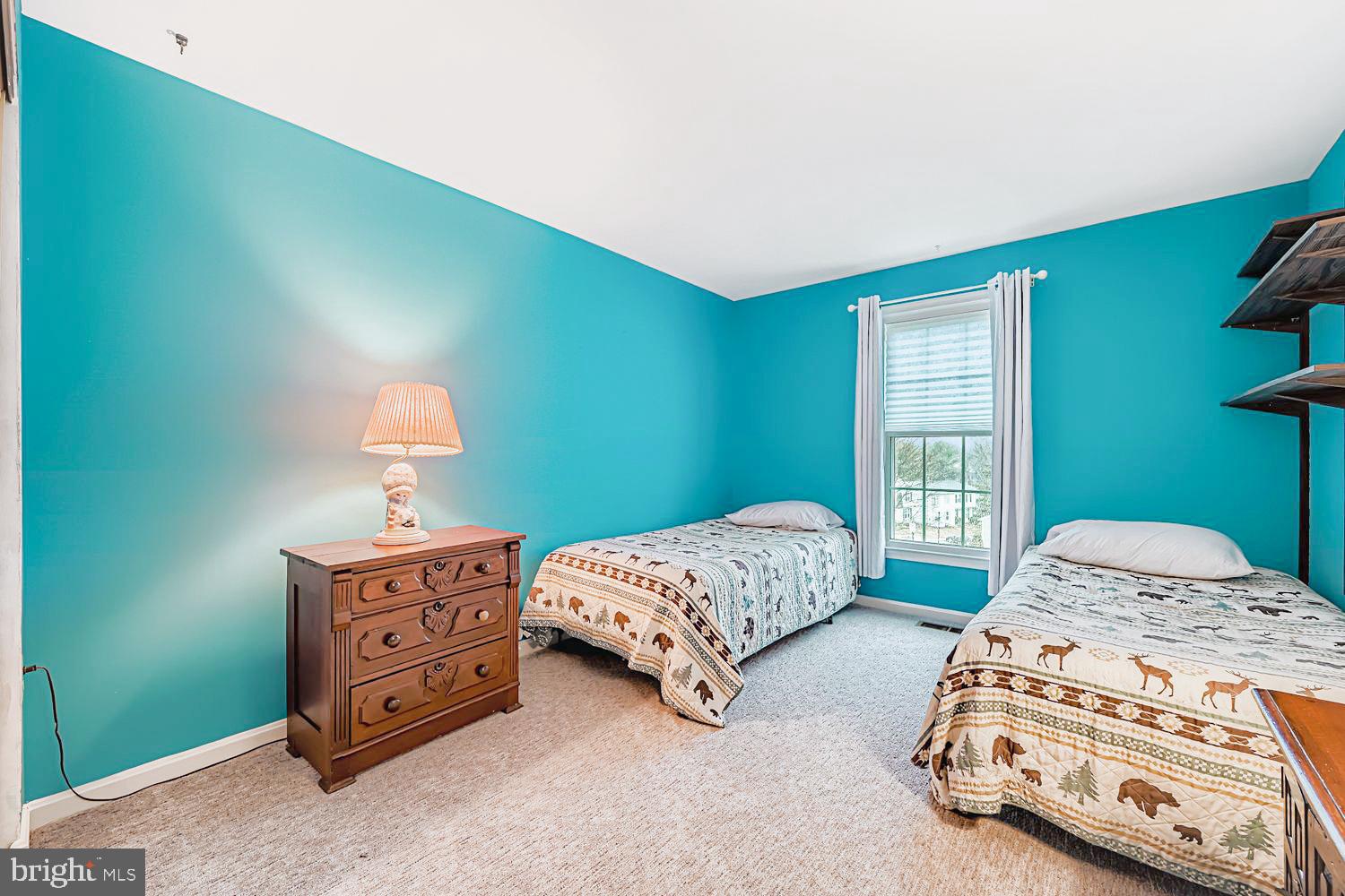 13229 Country Ridge Drive Germantown, MD 20874 - Photo 19 of 24 a bedroom with a bed lamp and a window