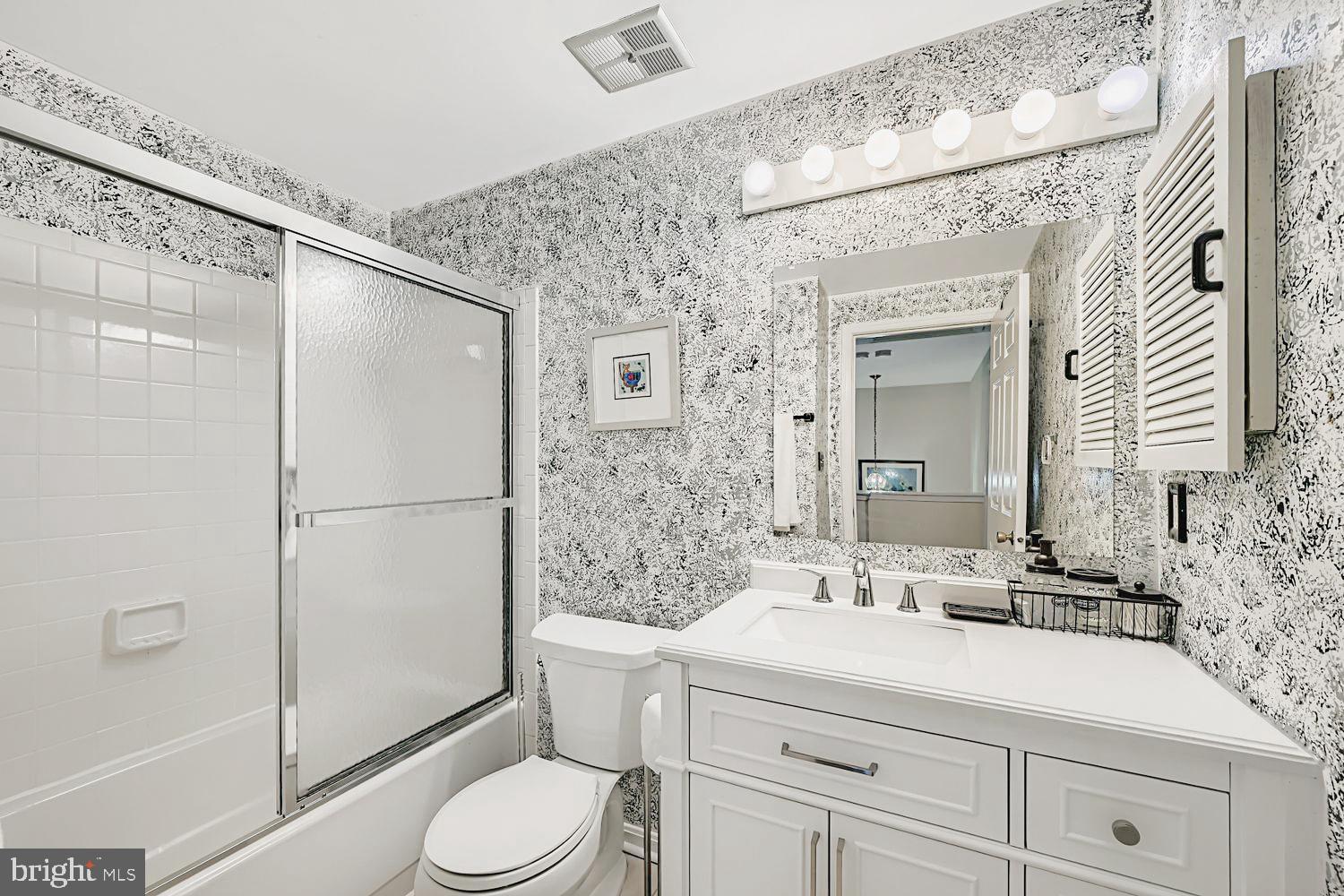 13229 Country Ridge Drive Germantown, MD 20874 - Photo 20 of 24 a bathroom with a sink a toilet and shower